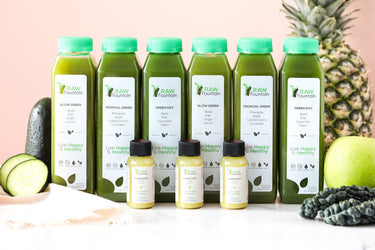 Raw Fountain juice bottles with fruit & kale